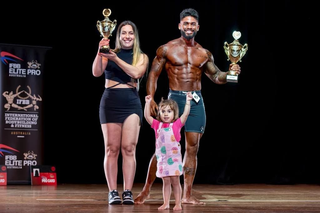 Ronan Costa with family holding competition trophies